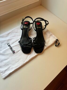 Larroude Black Patent Cross-Strap Sandals
Brand new never worn!!!
